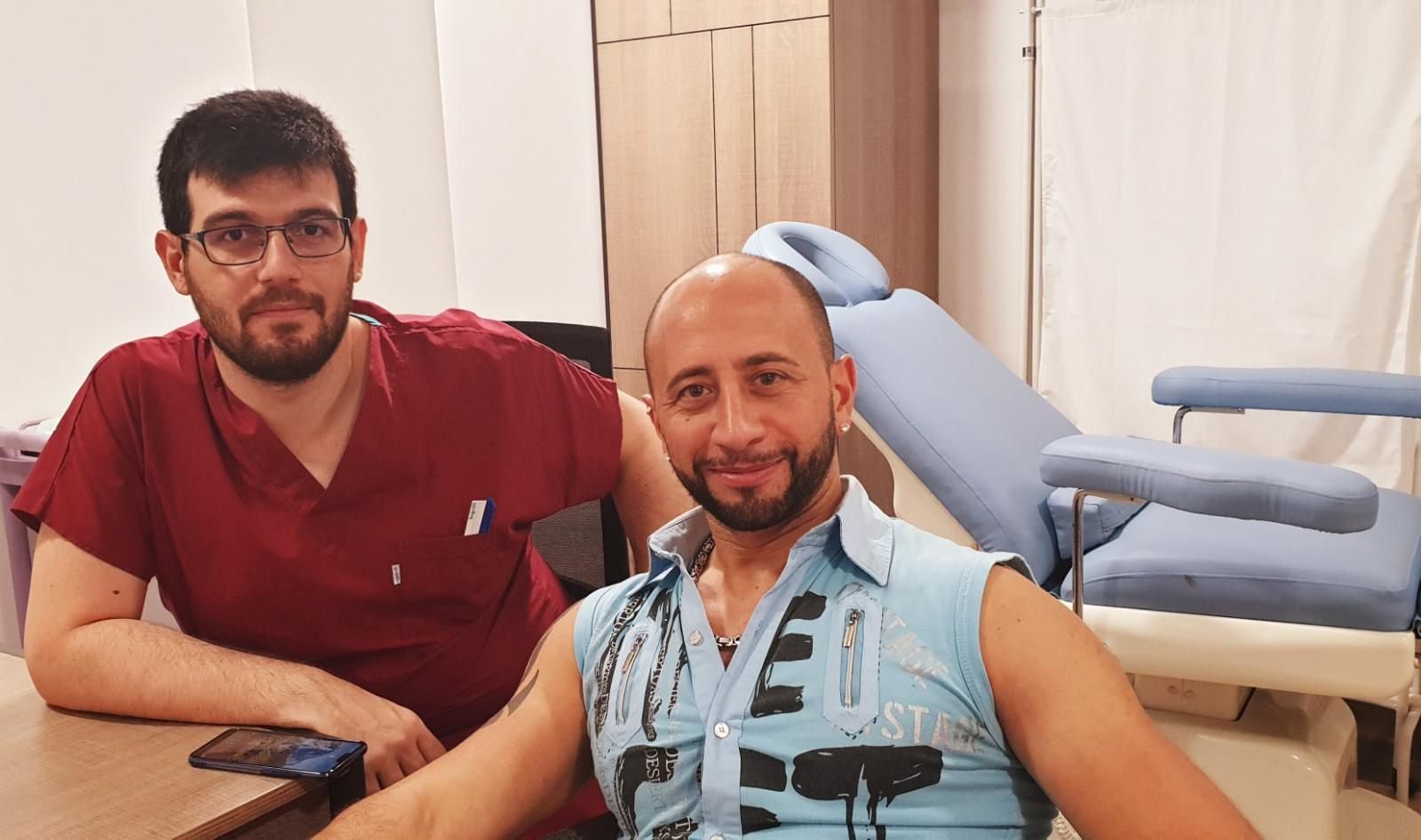 A patient with a clinician in a treatment room