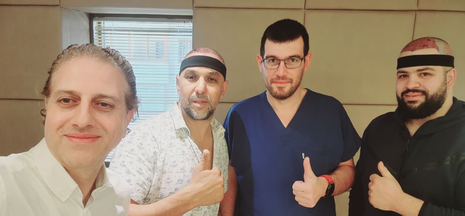 Two patients with their Academista coordinator and clinician, thumbs up after their procedures